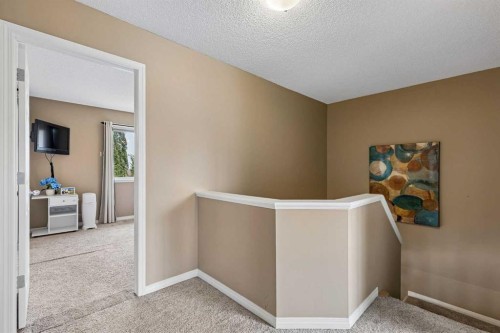 10-117 Bow Ridge Drive, Cochrane, AB - Indoor Photo Showing Other Room