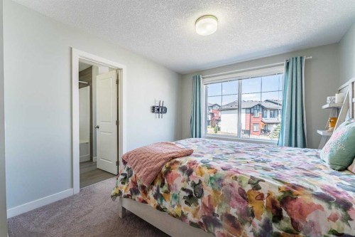 1207 Jumping Pound Common, Cochrane, AB - Indoor Photo Showing Bedroom