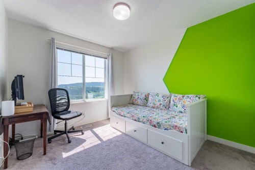 1207 Jumping Pound Common, Cochrane, AB - Indoor Photo Showing Bedroom