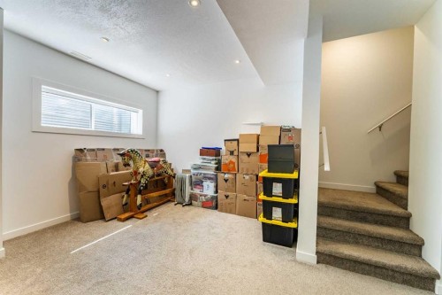 1207 Jumping Pound Common, Cochrane, AB - Indoor Photo Showing Other Room