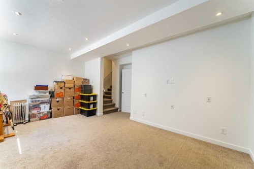 1207 Jumping Pound Common, Cochrane, AB - Indoor Photo Showing Other Room