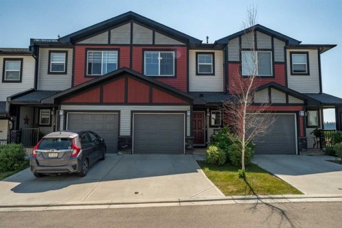 1207 Jumping Pound Common, Cochrane, AB - Outdoor With Facade