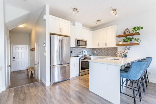 1207 Jumping Pound Common, Cochrane, AB - Indoor Photo Showing Kitchen