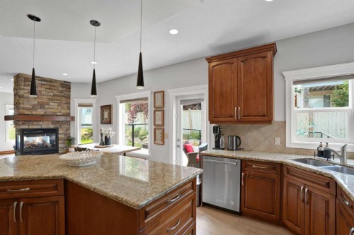 45 Sherwood View Nw, Calgary, AB - Indoor Photo Showing Kitchen With Fireplace With Double Sink