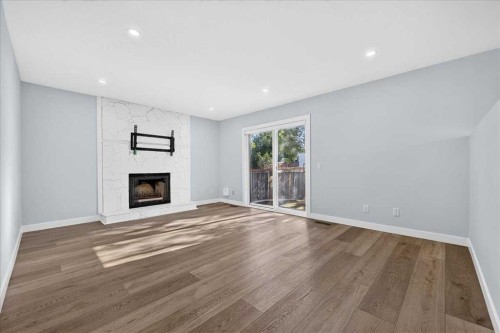 55 Whitehaven Crescent Ne, Calgary, AB - Indoor Photo Showing Living Room With Fireplace