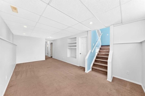 76 Coville Close Ne, Calgary, AB - Indoor Photo Showing Other Room