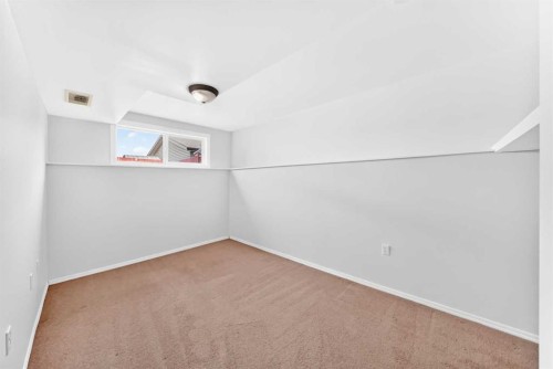 76 Coville Close Ne, Calgary, AB - Indoor Photo Showing Other Room