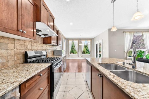182 Cranfield Manor Se, Calgary, AB - Indoor Photo Showing Kitchen With Double Sink