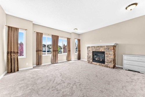 182 Cranfield Manor Se, Calgary, AB - Indoor Photo Showing Living Room With Fireplace