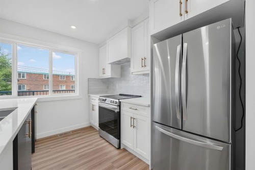 2018 12 Avenue Sw, Calgary, AB - Indoor Photo Showing Kitchen With Double Sink With Upgraded Kitchen