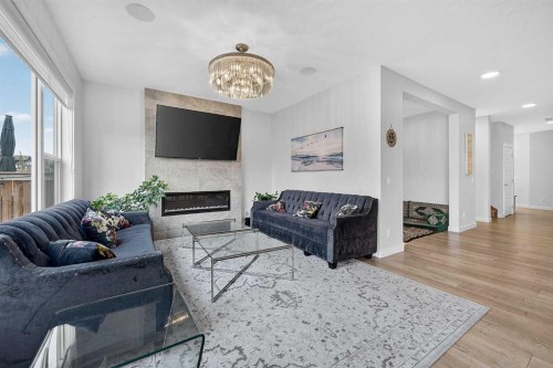 2177 Ravensdun Crescent Se, Airdrie, AB - Indoor Photo Showing Living Room With Fireplace