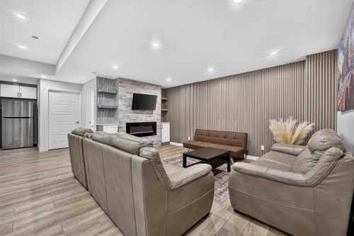 2177 Ravensdun Crescent Se, Airdrie, AB - Indoor With Fireplace