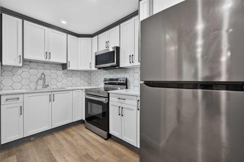 2177 Ravensdun Crescent Se, Airdrie, AB - Indoor Photo Showing Kitchen