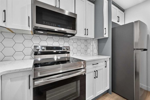 2177 Ravensdun Crescent Se, Airdrie, AB - Indoor Photo Showing Kitchen