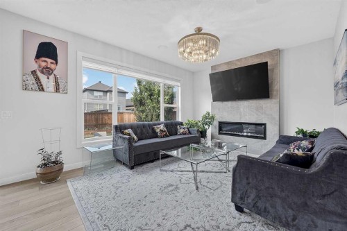 2177 Ravensdun Crescent Se, Airdrie, AB - Indoor Photo Showing Living Room With Fireplace