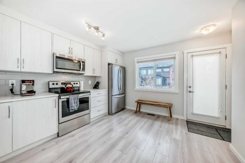 128-31 Red Embers Parade Ne, Calgary, AB - Indoor Photo Showing Kitchen With Stainless Steel Kitchen