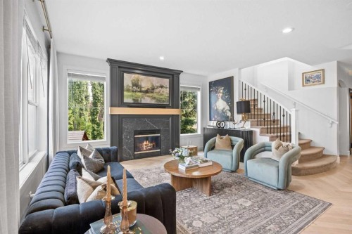 31 Crestridge Way Sw, Calgary, AB - Indoor Photo Showing Living Room With Fireplace