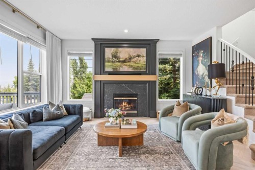 31 Crestridge Way Sw, Calgary, AB - Indoor Photo Showing Living Room With Fireplace