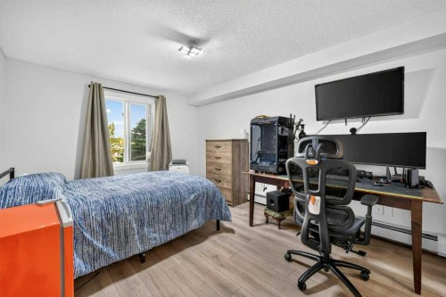 2207-12 Cimarron Common, Okotoks, AB - Indoor Photo Showing Bedroom