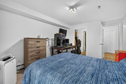 2207-12 Cimarron Common, Okotoks, AB - Indoor Photo Showing Bedroom