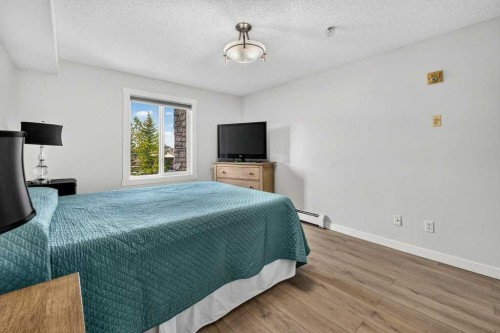2207-12 Cimarron Common, Okotoks, AB - Indoor Photo Showing Bedroom
