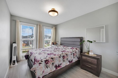 1265 Carrington Boulevard Nw, Calgary, AB - Indoor Photo Showing Bedroom