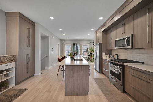 1265 Carrington Boulevard Nw, Calgary, AB - Indoor Photo Showing Kitchen With Upgraded Kitchen