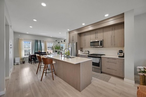 1265 Carrington Boulevard Nw, Calgary, AB - Indoor Photo Showing Kitchen With Upgraded Kitchen