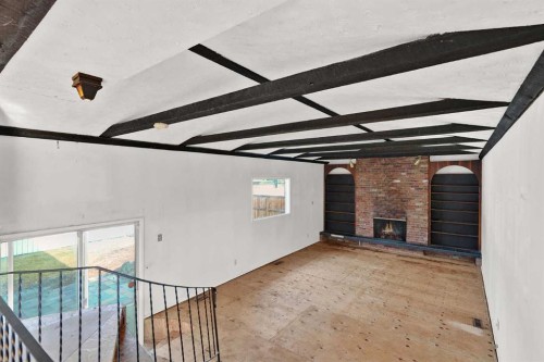 9743 Academy Drive Se, Calgary, AB - Indoor Photo Showing Other Room With Fireplace