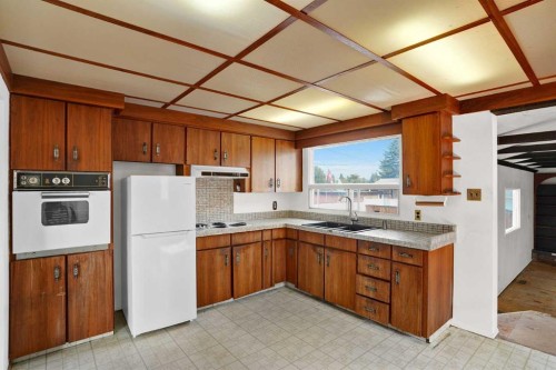 9743 Academy Drive Se, Calgary, AB - Indoor Photo Showing Kitchen With Double Sink