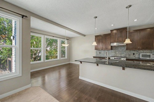 64 Copperpond Terrace Se, Calgary, AB - Indoor Photo Showing Kitchen With Double Sink