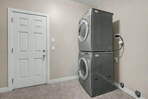 64 Copperpond Terrace Se, Calgary, AB - Indoor Photo Showing Laundry Room