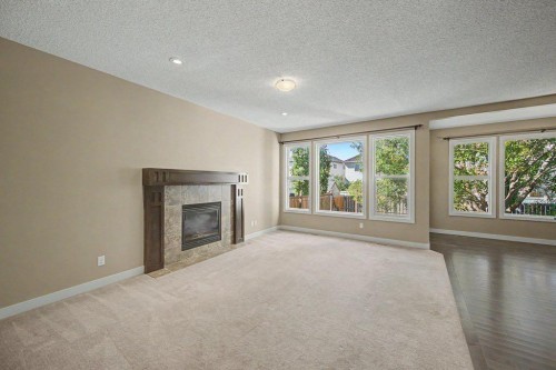 64 Copperpond Terrace Se, Calgary, AB - Indoor Photo Showing Living Room With Fireplace