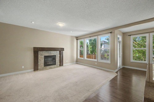 64 Copperpond Terrace Se, Calgary, AB - Indoor Photo Showing Living Room With Fireplace