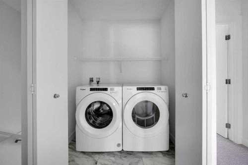 693 Savanna Boulevard Ne, Calgary, AB - Indoor Photo Showing Laundry Room