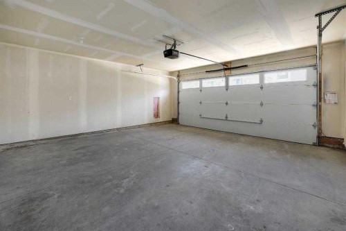 693 Savanna Boulevard Ne, Calgary, AB - Indoor Photo Showing Garage