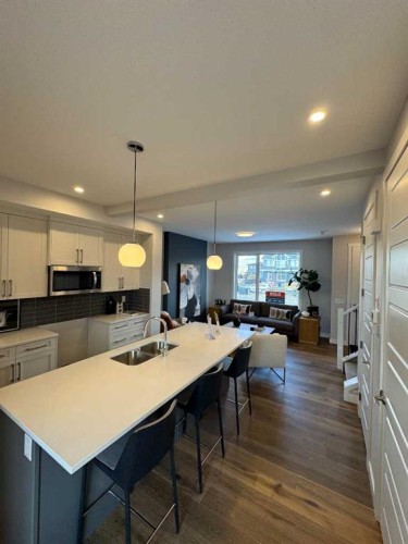 191 Lanark Gate Se, Airdrie, AB - Indoor Photo Showing Kitchen With Double Sink