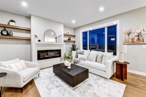 540 Lawthorn Way, Airdrie, AB - Indoor Photo Showing Living Room With Fireplace