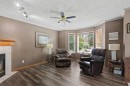 311 Erin Circle Se, Calgary, AB  - Indoor Photo Showing Living Room With Fireplace 
