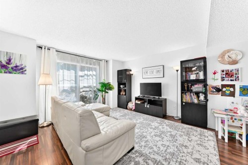 53 Tuscany Springs Heights Nw, Calgary, AB - Indoor Photo Showing Living Room