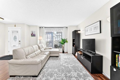 53 Tuscany Springs Heights Nw, Calgary, AB - Indoor Photo Showing Living Room