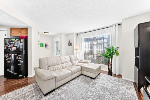 53 Tuscany Springs Heights Nw, Calgary, AB - Indoor Photo Showing Living Room