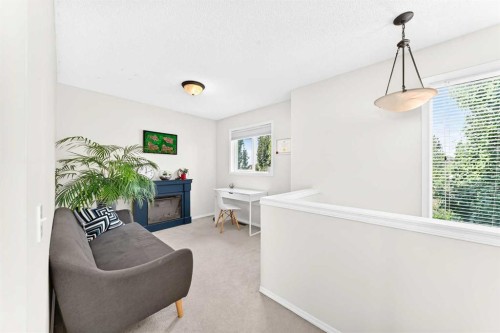 53 Tuscany Springs Heights Nw, Calgary, AB - Indoor With Fireplace