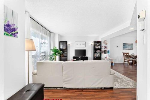 53 Tuscany Springs Heights Nw, Calgary, AB - Indoor Photo Showing Living Room
