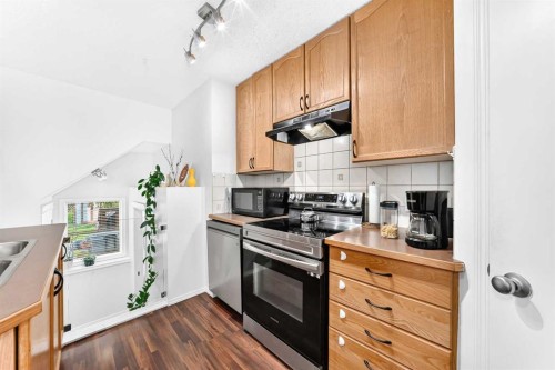 53 Tuscany Springs Heights Nw, Calgary, AB - Indoor Photo Showing Kitchen With Double Sink