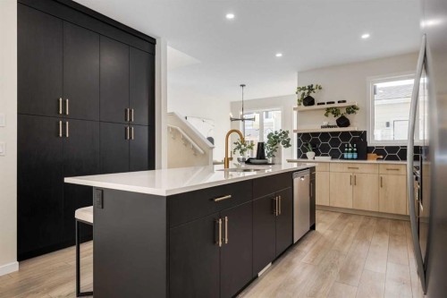 88 Bluerock Terrace Sw, Calgary, AB - Indoor Photo Showing Kitchen With Double Sink