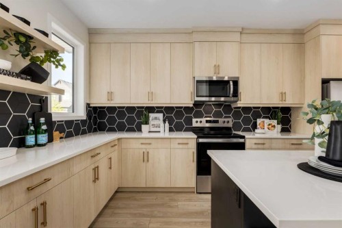 88 Bluerock Terrace Sw, Calgary, AB - Indoor Photo Showing Kitchen
