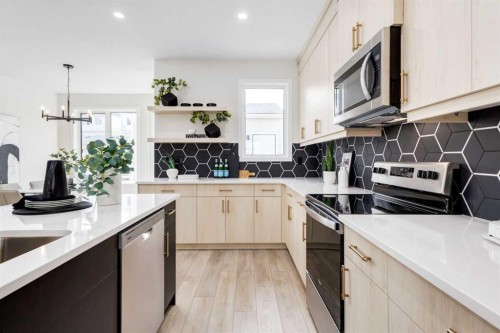 88 Bluerock Terrace Sw, Calgary, AB - Indoor Photo Showing Kitchen With Upgraded Kitchen
