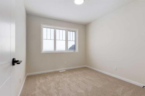 88 Bluerock Terrace Sw, Calgary, AB - Indoor Photo Showing Other Room