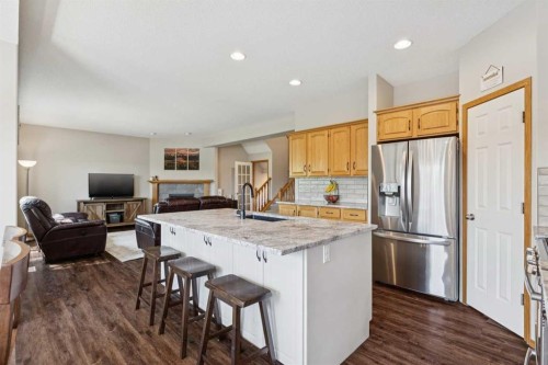 16 Henderson Bay Ne, Langdon, AB - Indoor Photo Showing Kitchen With Stainless Steel Kitchen With Upgraded Kitchen